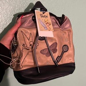Kipling tinker bell collab small backpack with drawstrings.